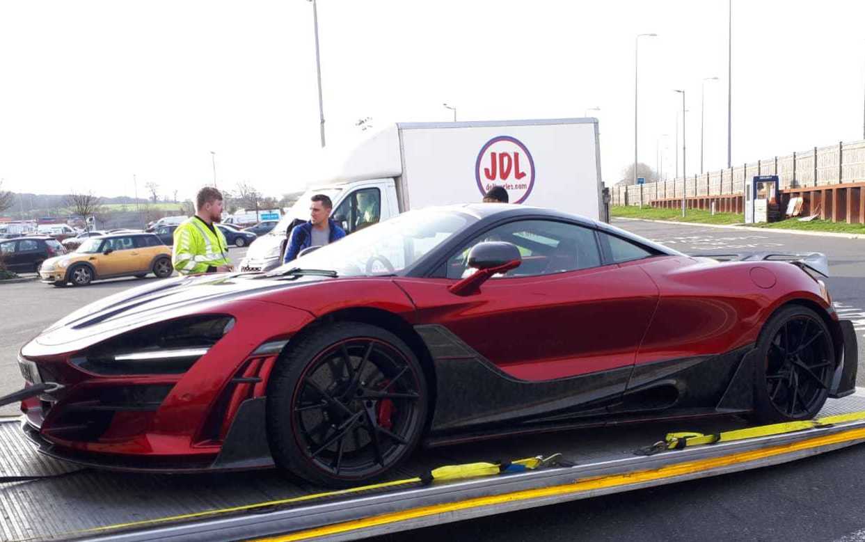 Sports car being collected for courier